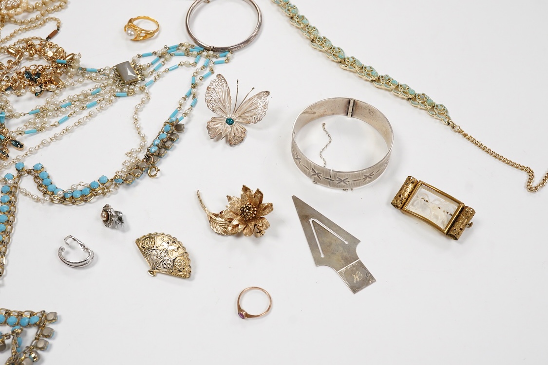 A 9ct and cabochon black onyx set pendant, on a 9ct chain, a 9ct and gem set ring and pair of 9ct and cultured pearl set ear clips, together with other items including costume jewellery, a silver bangle and a silver book